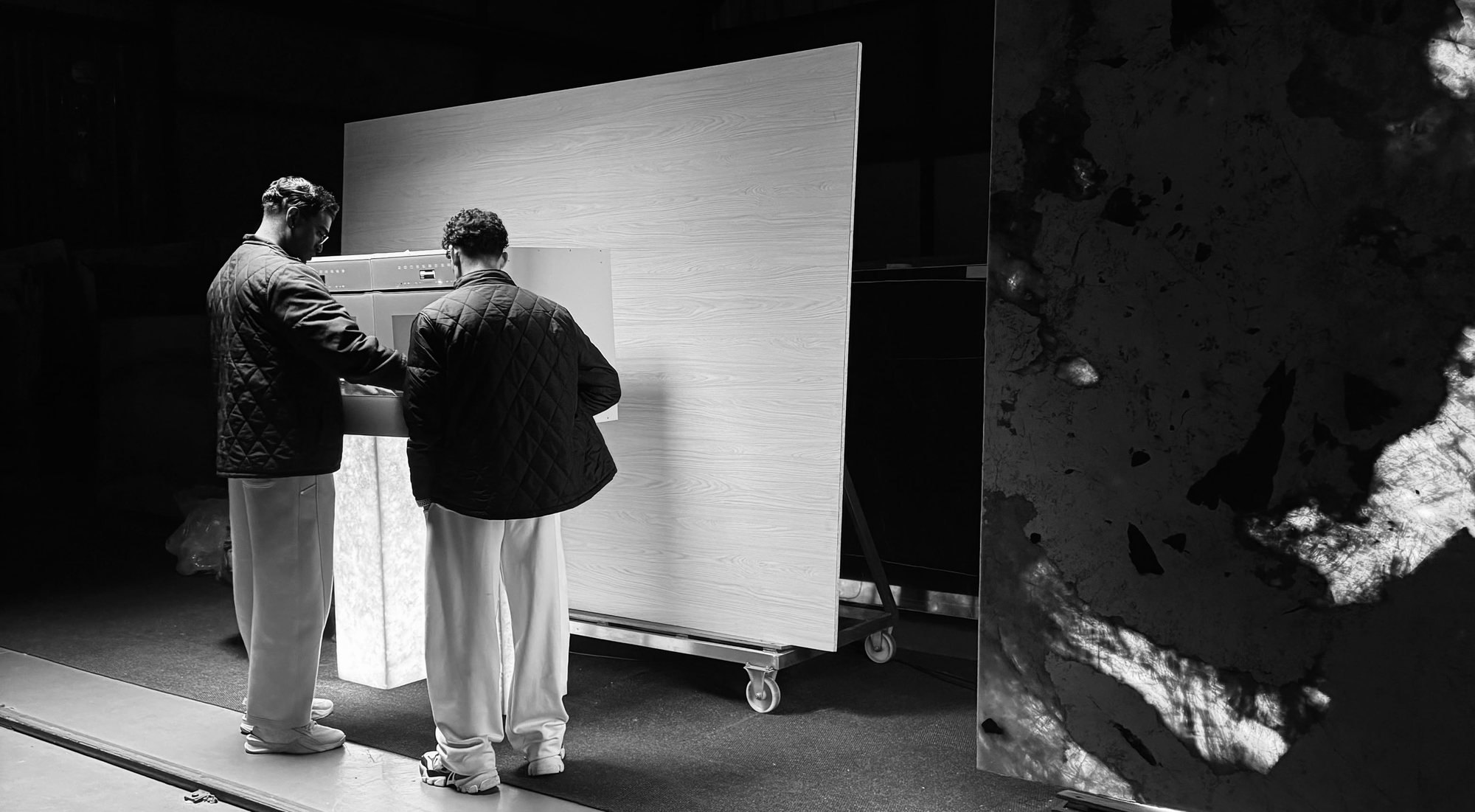 Interiology™ founders, the two directors, with timber and stone at the studio
