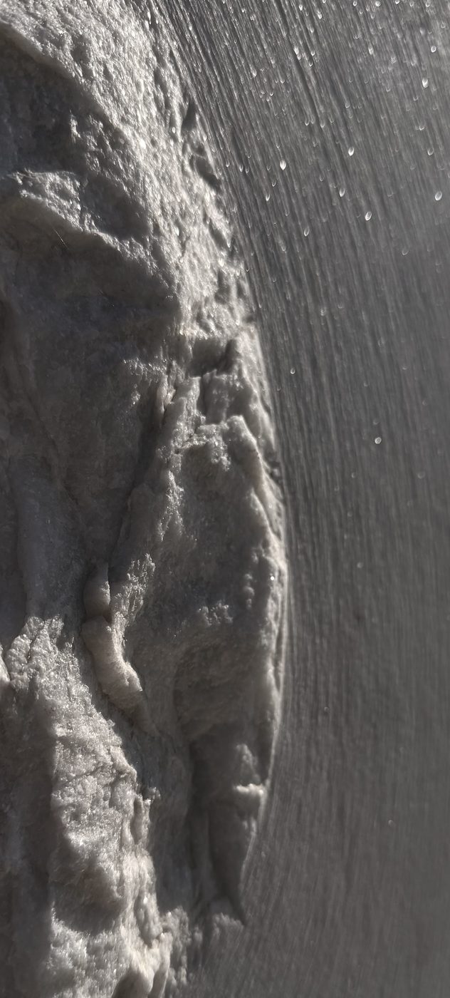 Honed stone edge detail against a smooth finished surface