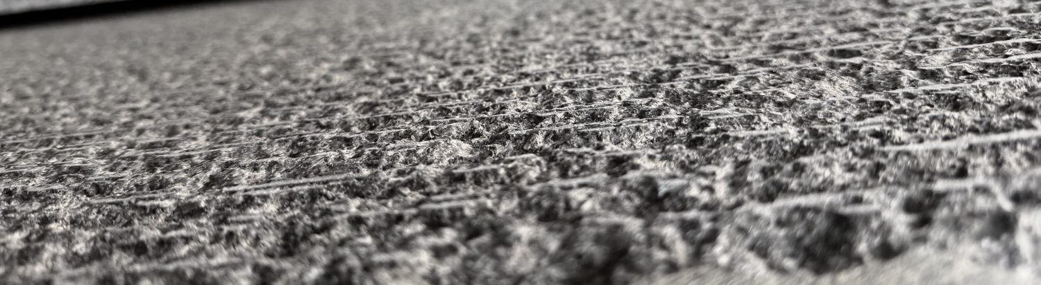Close-up of a honed natural stone surface texture